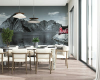 Moody Scandinavian mural featuring imposing stone mountains and a peaceful shoreline home.