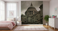 London Grandeur wallpaper mural of St Paul's behind a pink bed with rainbow pillows in a girls bedroom