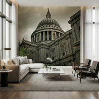 London Grandeur wallpaper mural of the cathedral dome behind a white sectional sofa and leather chairs in a living room