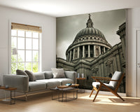 London Grandeur wallpaper mural of the cathedral under a grey sky behind a grey sofa and wood chair in a living room