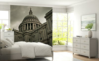 London Grandeur wallpaper mural of the cathedral dome behind a white bed and grey dresser in a bright bedroom