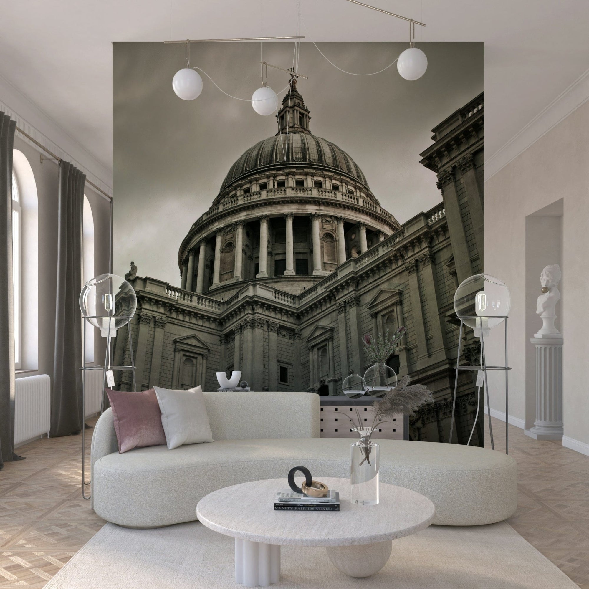 London Grandeur wallpaper mural of St Paul's Cathedral dome behind a curved cream sofa with pink pillows in a living room