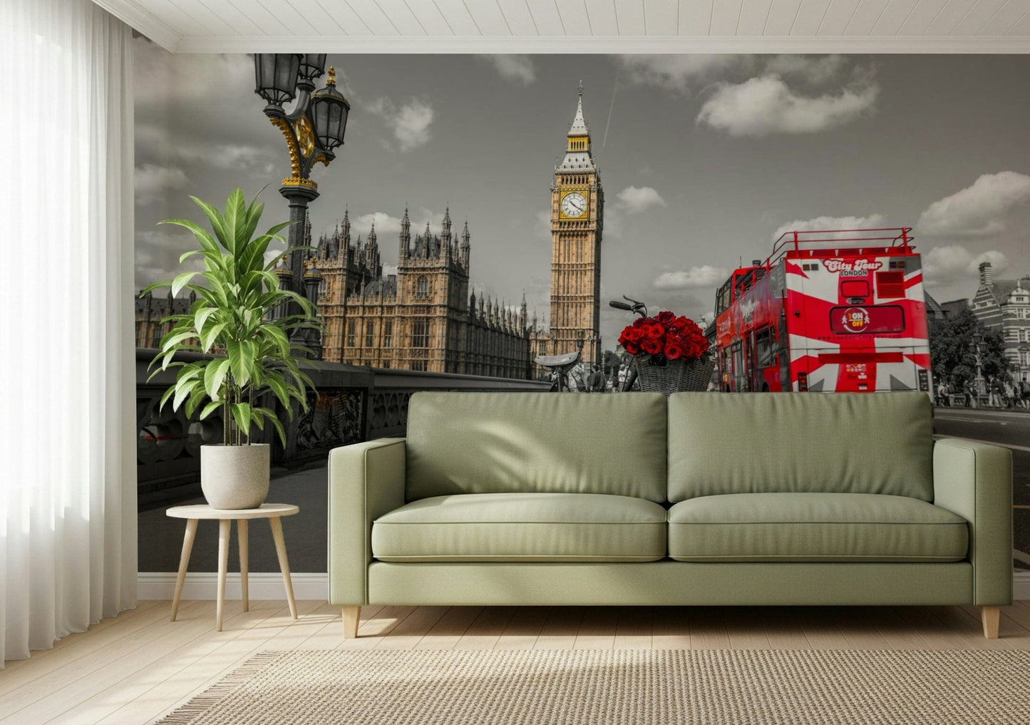 London Ride wallpaper mural behind a sage green sofa with a potted plant in a living room