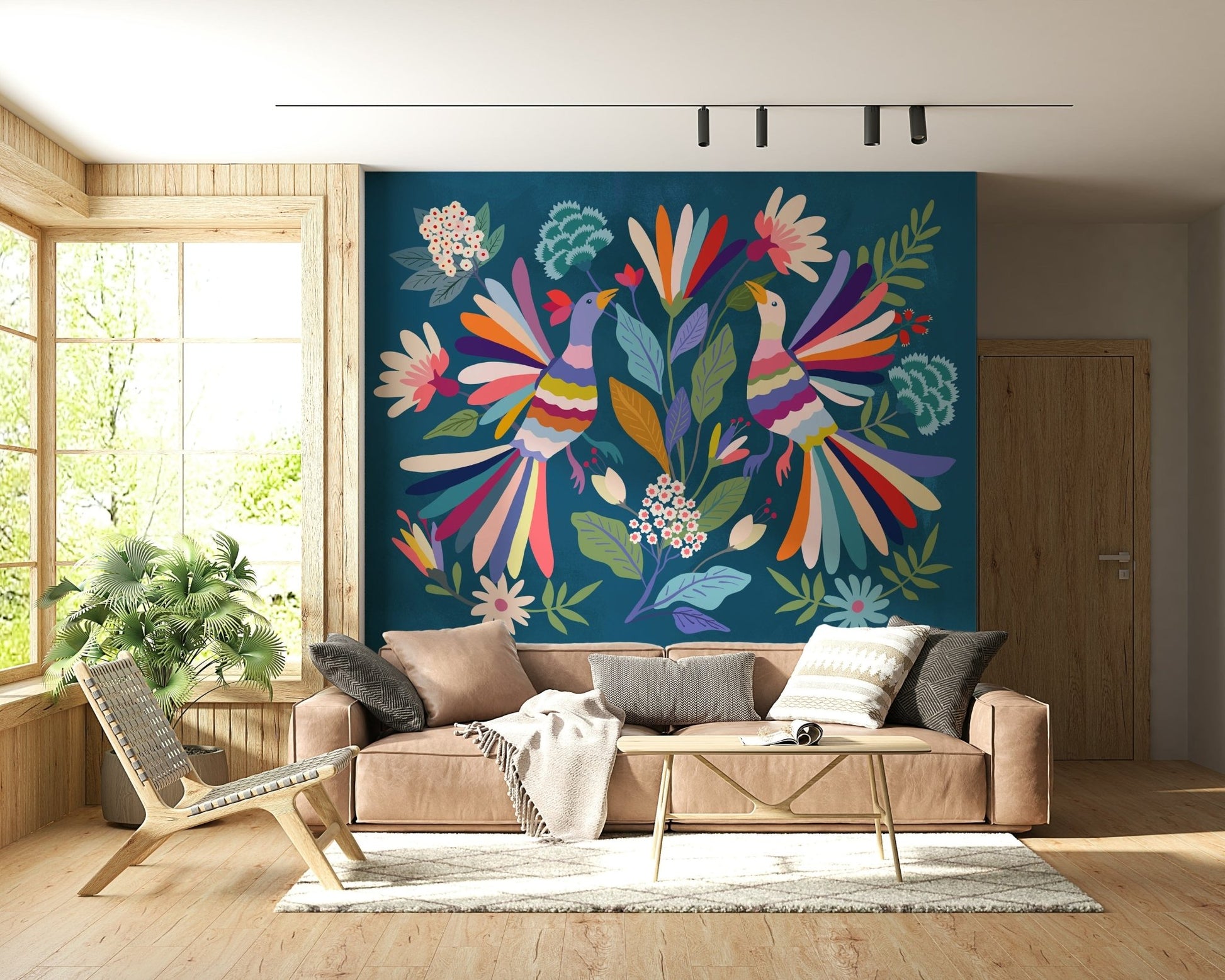 Love Birds mural in rainbow colors on teal behind a beige sofa and wooden lounge chair in a living room
