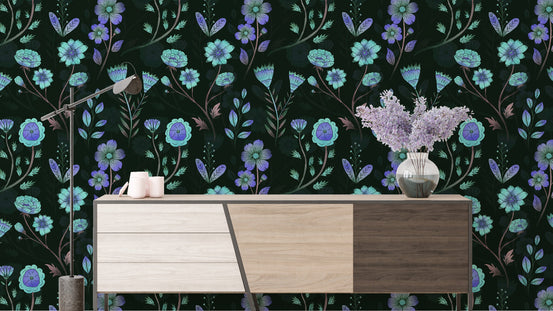 Luminous Floral Whispers Bluish Tones wallpaper behind a wood sideboard with an arc lamp and lilac blooms