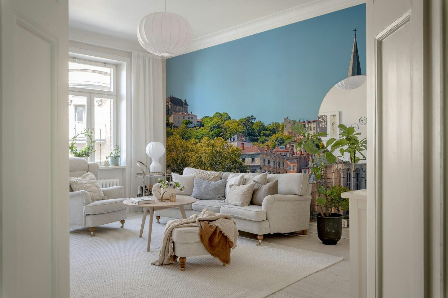 Riverfront Lyon mural in entryway, calm modern home styling