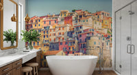 Manarola Vista wall mural of colorful cliff houses behind a freestanding tub in a modern bathroom