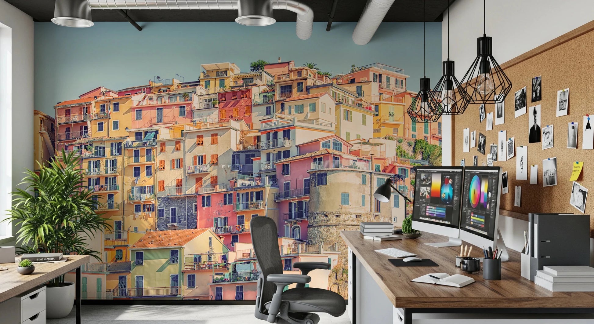 Manarola Vista wall mural of colorful seaside houses behind a dual-monitor desk in a home office