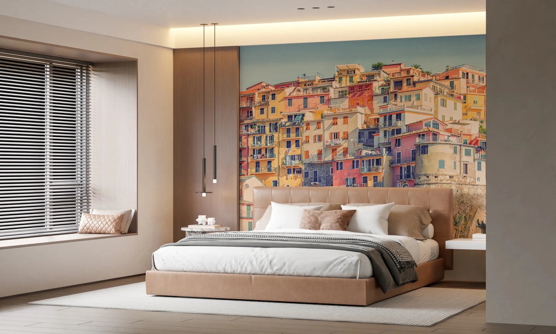Manarola Vista wall mural of colorful cliff houses above a tan bed in a warm modern bedroom