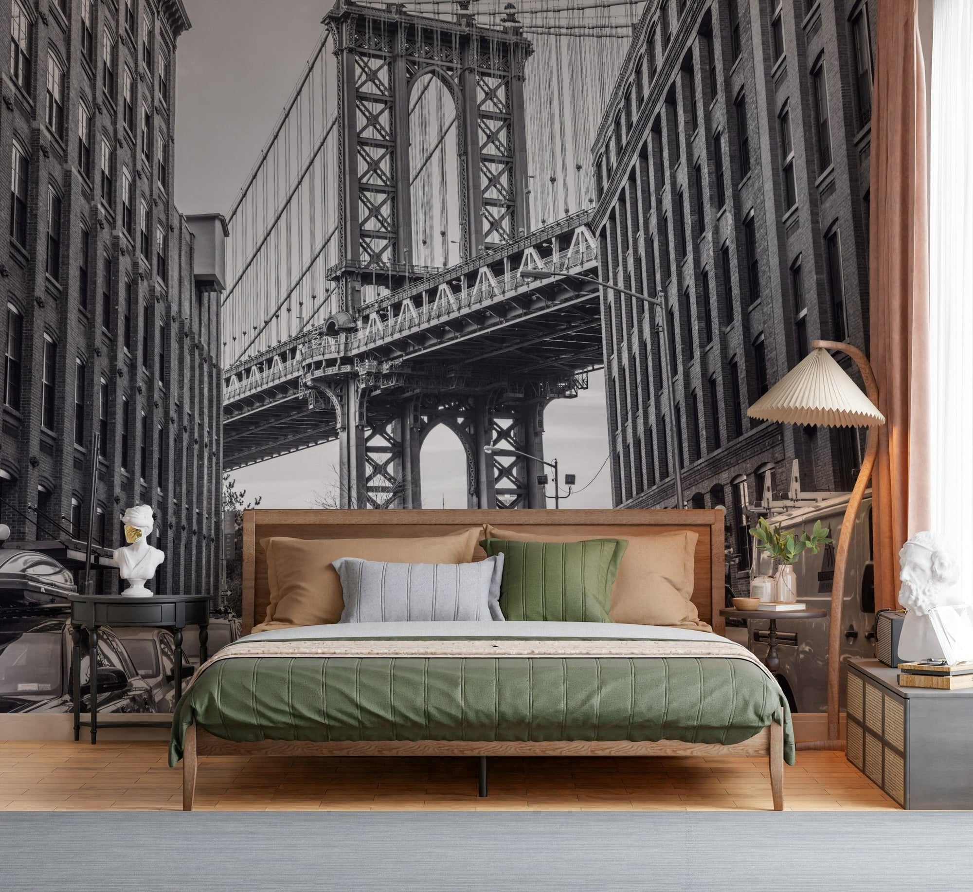 Manhattan Bridge from the Dumbo wallpaper mural in black and white behind a wooden bed with green and tan bedding
