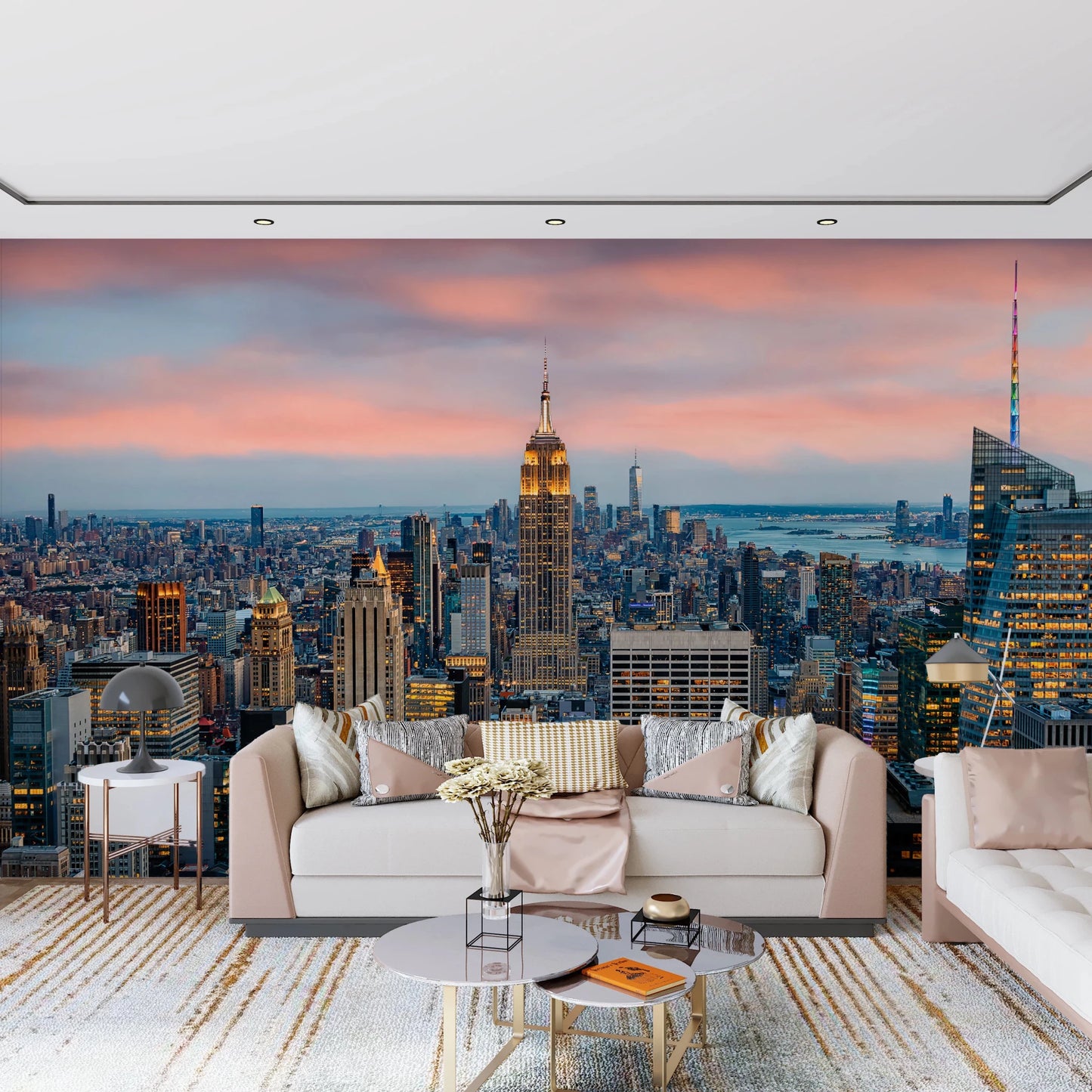 Manhattan Dawn wallpaper mural of the skyline at dusk behind a cream sofa with satin pillows