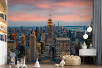Manhattan Dawn wallpaper mural with the Empire State Building behind a white shelving unit in a kids room
