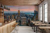 Manhattan Dawn wallpaper mural of Manhattan in a bar with a wood counter, stools and exposed brick