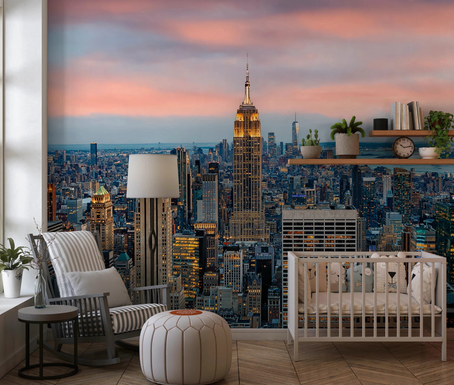 Manhattan Dawn wallpaper mural of the skyline behind a white crib and striped rocking chair in a nursery
