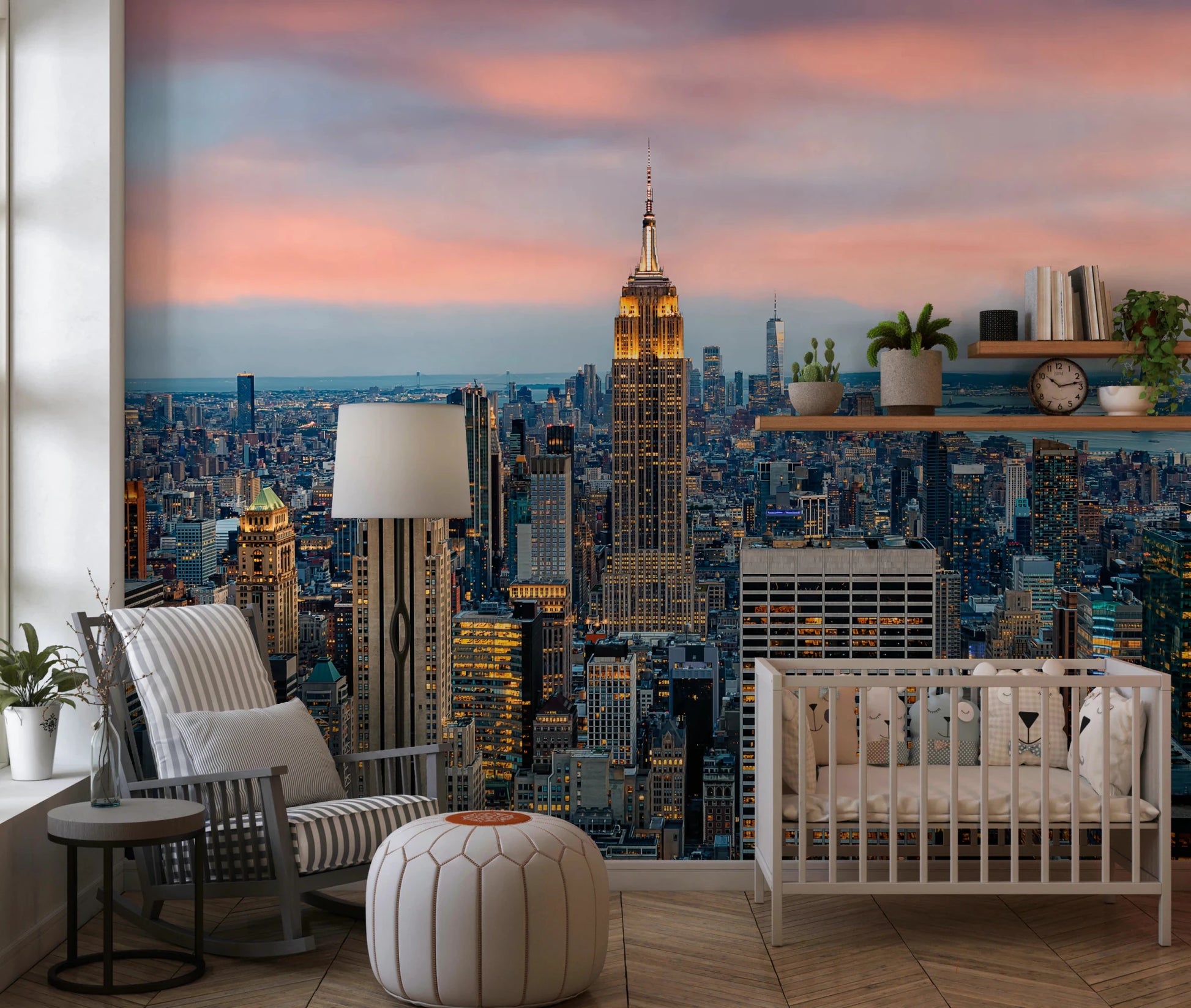 Manhattan Dawn wallpaper mural of the skyline behind a white crib and striped rocking chair in a nursery