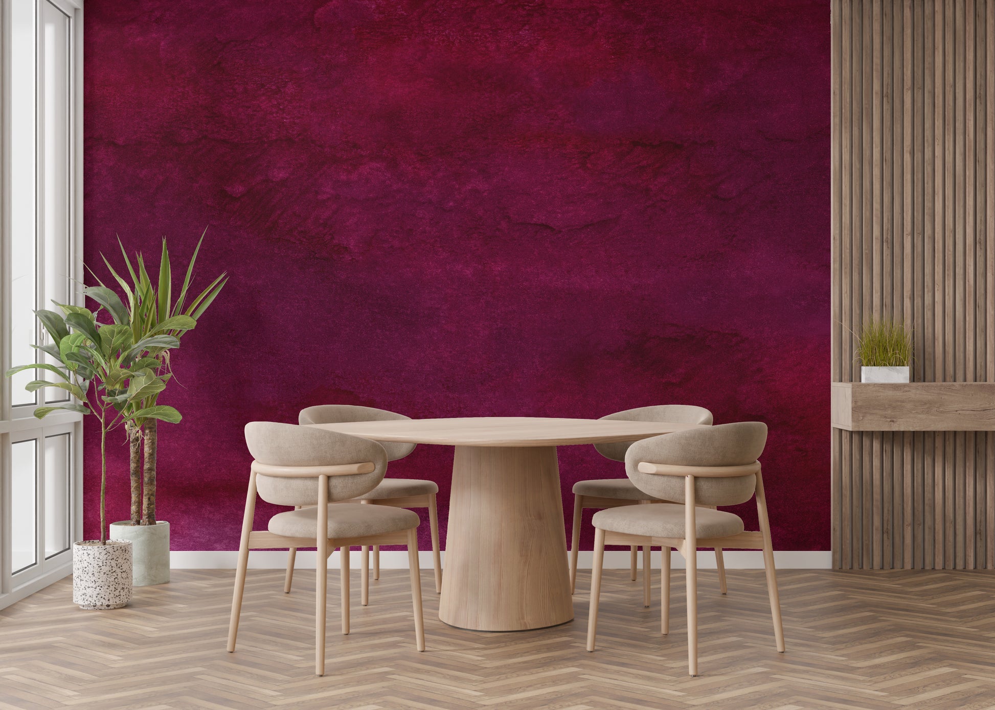 Maroon Watercolor wallpaper mural in rich maroon behind a round wood table and beige chairs in a modern dining room