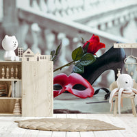 Masquerade Romance wallpaper mural close-up of red mask and rose in a nursery with wooden toy shelf and plush octopus toy