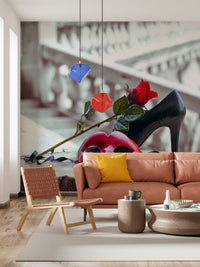 Masquerade Romance wallpaper mural with red mask, rose and black heel on stairs behind a terracotta sofa and yellow cushion