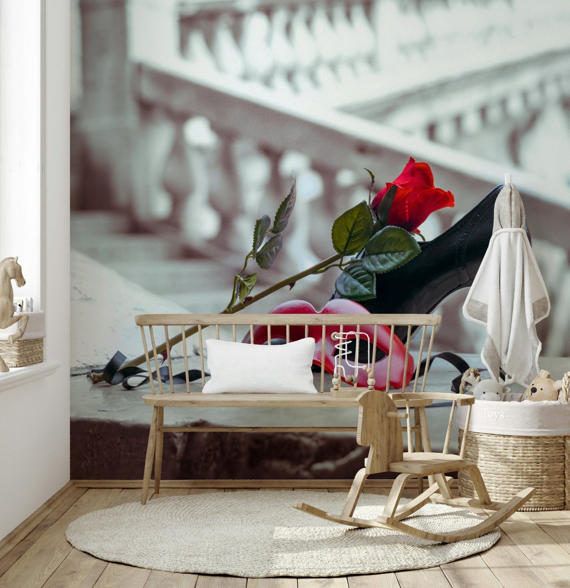 Masquerade Romance wallpaper mural in a kids room with wooden bench, child's rocking chair and basket of stuffed toys