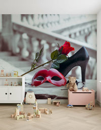 Masquerade Romance wallpaper mural of red carnival mask and rose in a kids playroom with white cabinet and pink toy chest
