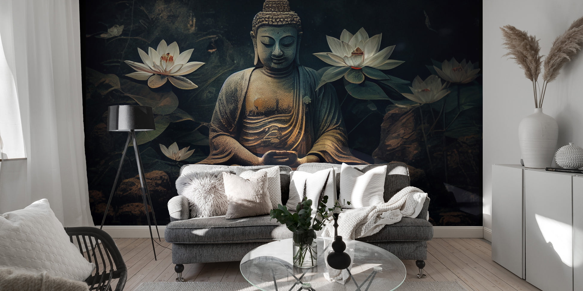 Meditative Buddha and Lotus Flowers wallpaper mural in dark moody tones behind a grey sofa with a tripod floor lamp in a living room