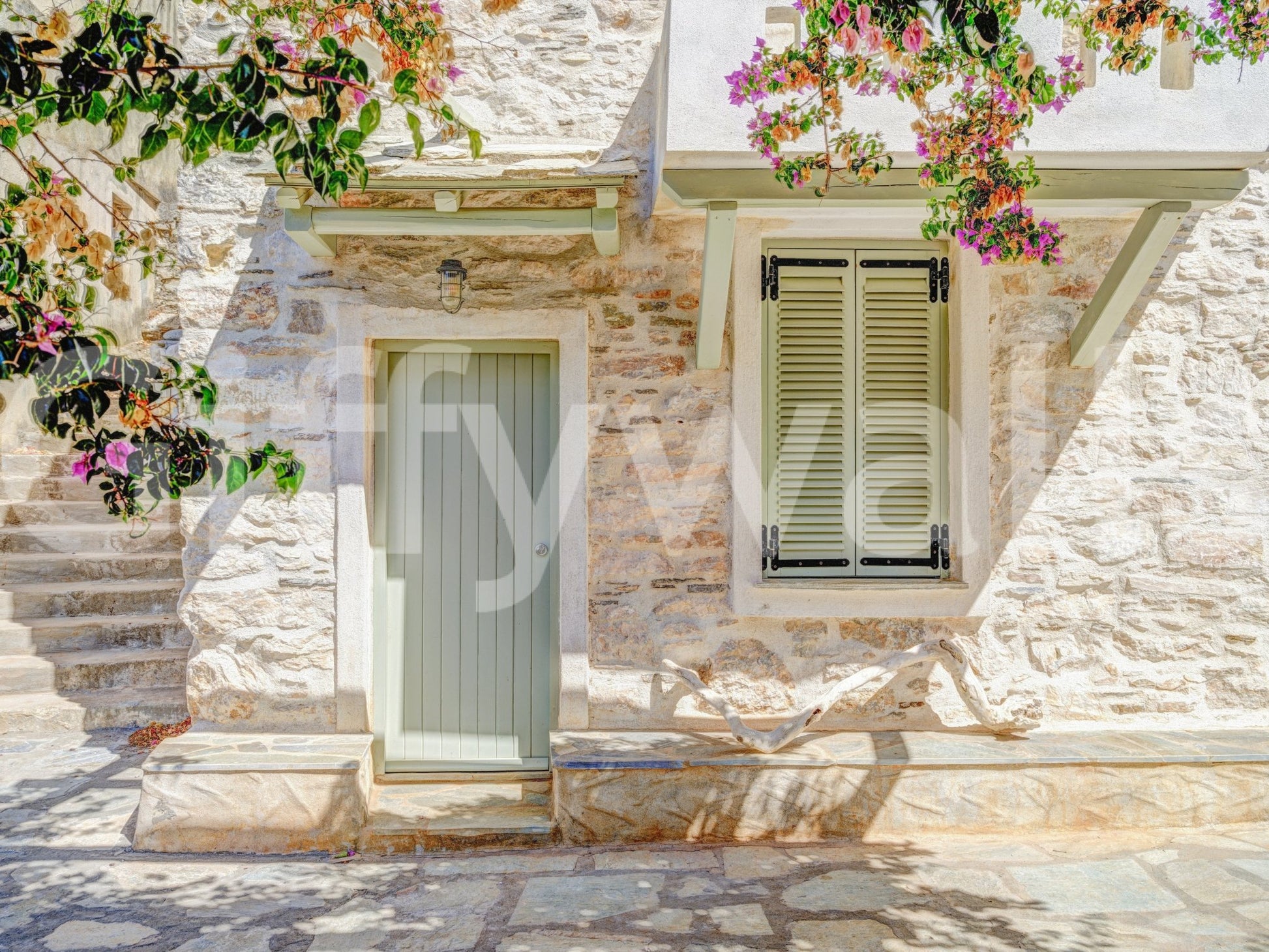 Mediterranean Doorway Charm Wall Mural highlighting soft pastel florals.