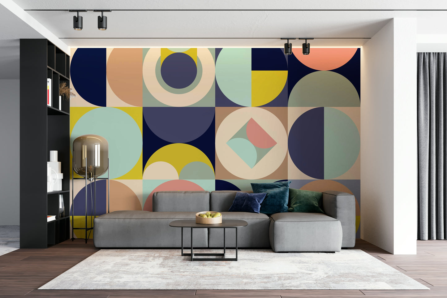 Mescolanza Alt V3 wallpaper mural of mid-century circles behind a grey sectional sofa and black shelving in a living room