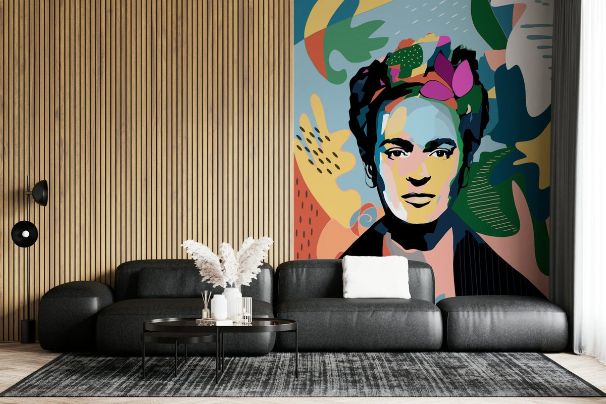 Mexican Icon wallpaper mural of a colorful pop-art Frida portrait behind a black leather sofa and wood-slat wall in a living room