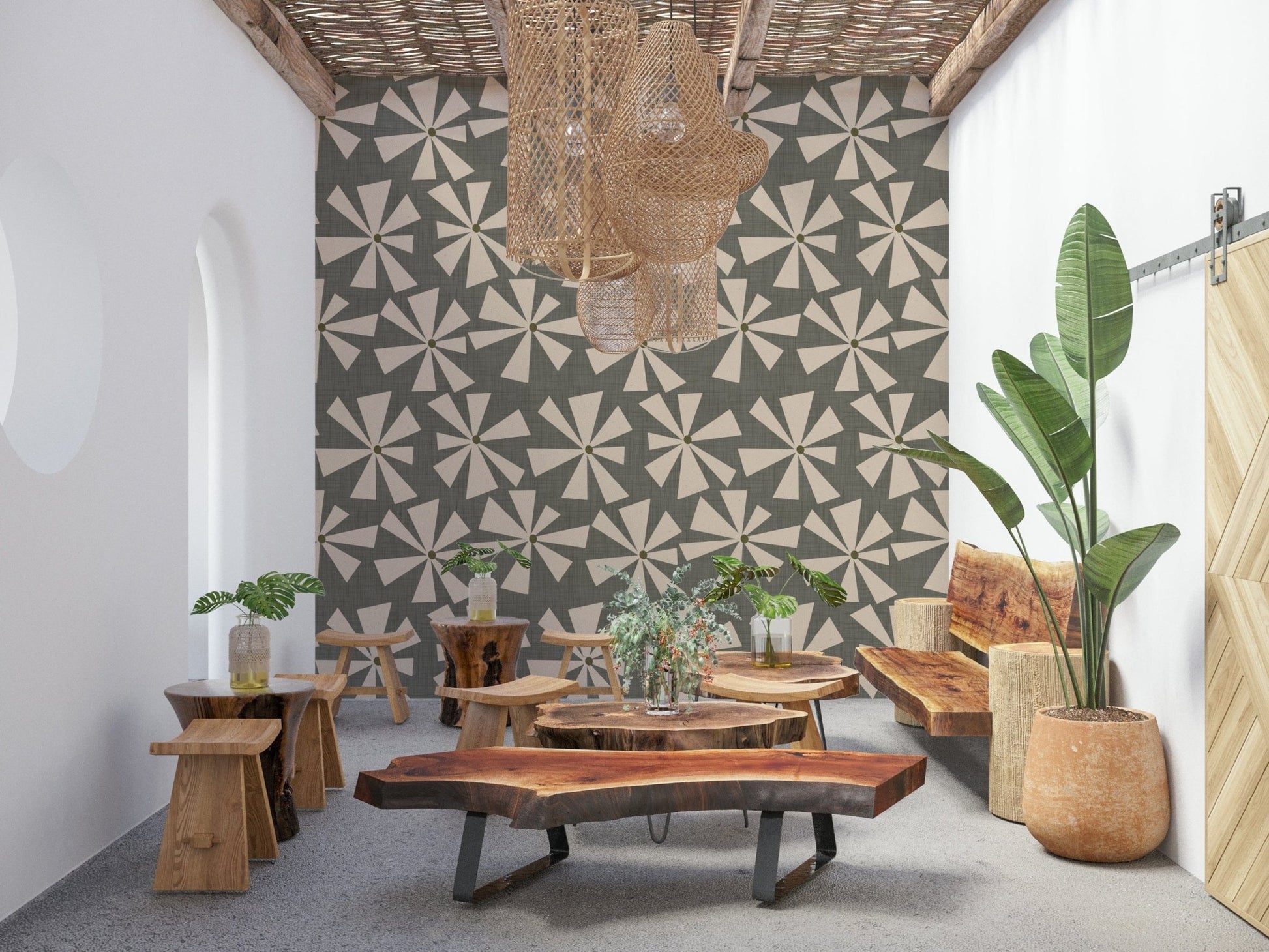 Mid-century bloom wallpaper featuring cream starburst flowers on a muted green background.