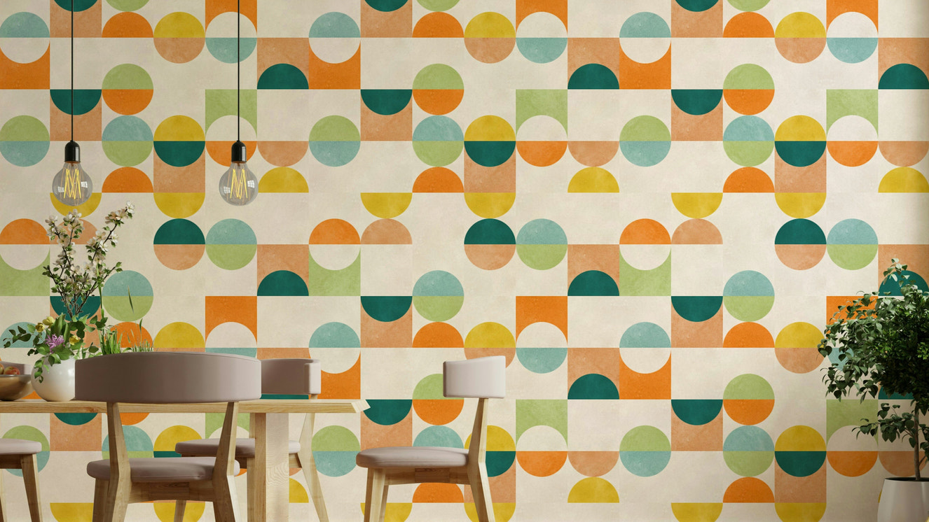 The design features interconnected circles, ovals, and abstract forms.

