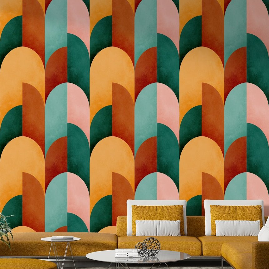 Mid Mod Geometry Sunburn wallpaper mural behind a light wood dining table with pendant bulbs and a potted plant