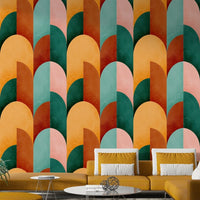 Mid Mod Geometry Sunburn wallpaper mural behind a light wood dining table with pendant bulbs and a potted plant