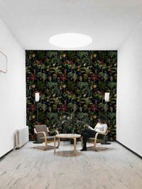 Midnight jungle mural featuring colorful flora and dramatic shadows.

