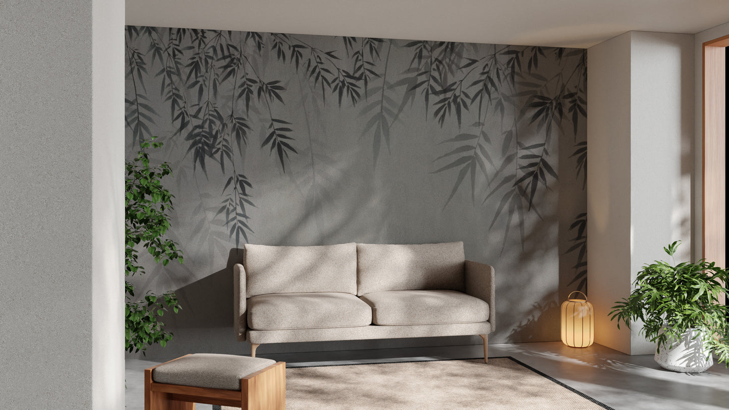Minimalist Botanical Sketch wallpaper in grey with sketched bamboo leaves behind a beige sofa in a calm living room