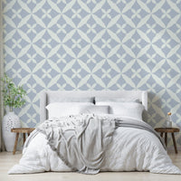 Geometric blue and cream pattern wallpaper.