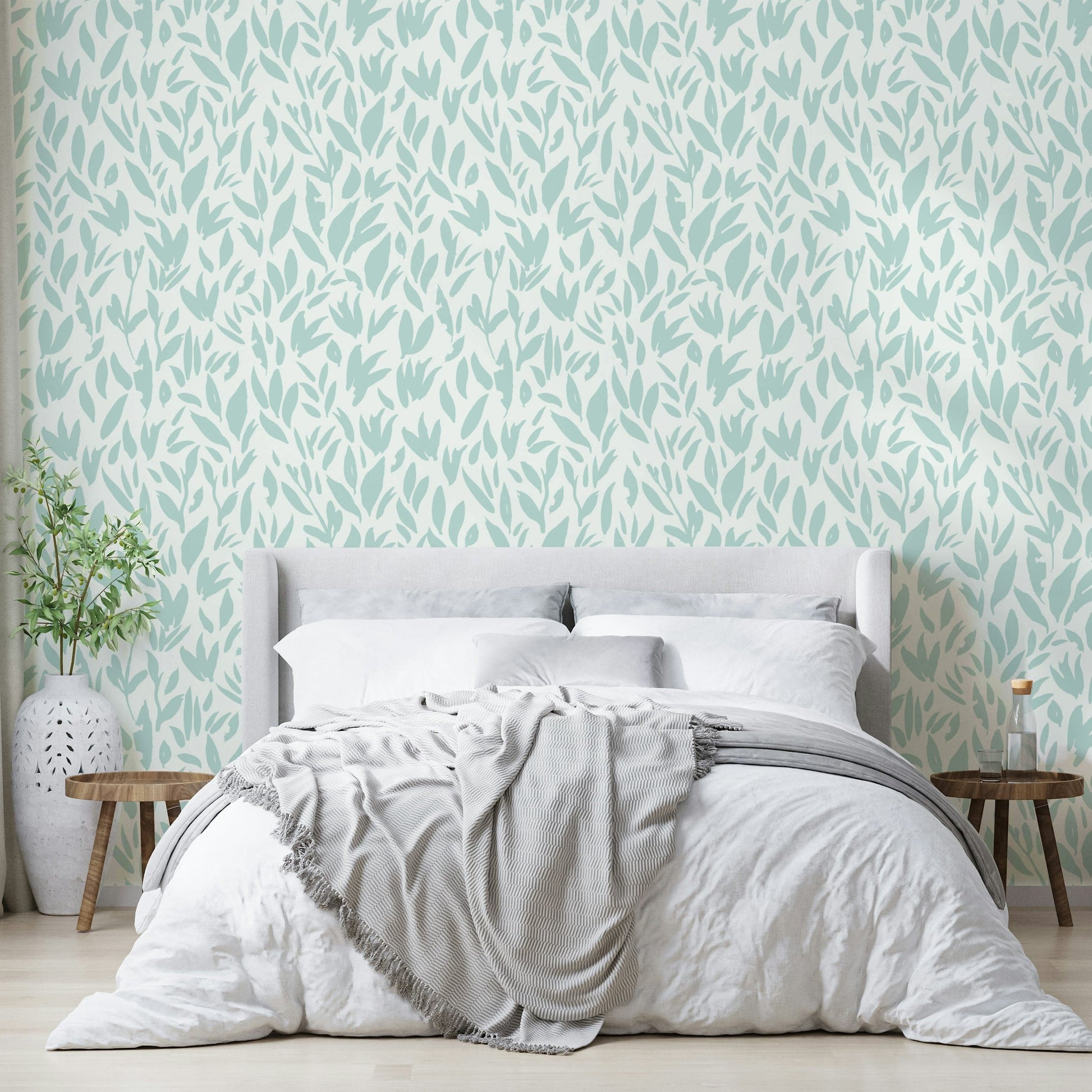 Subtle mint branch wallpaper for a serene bedroom.