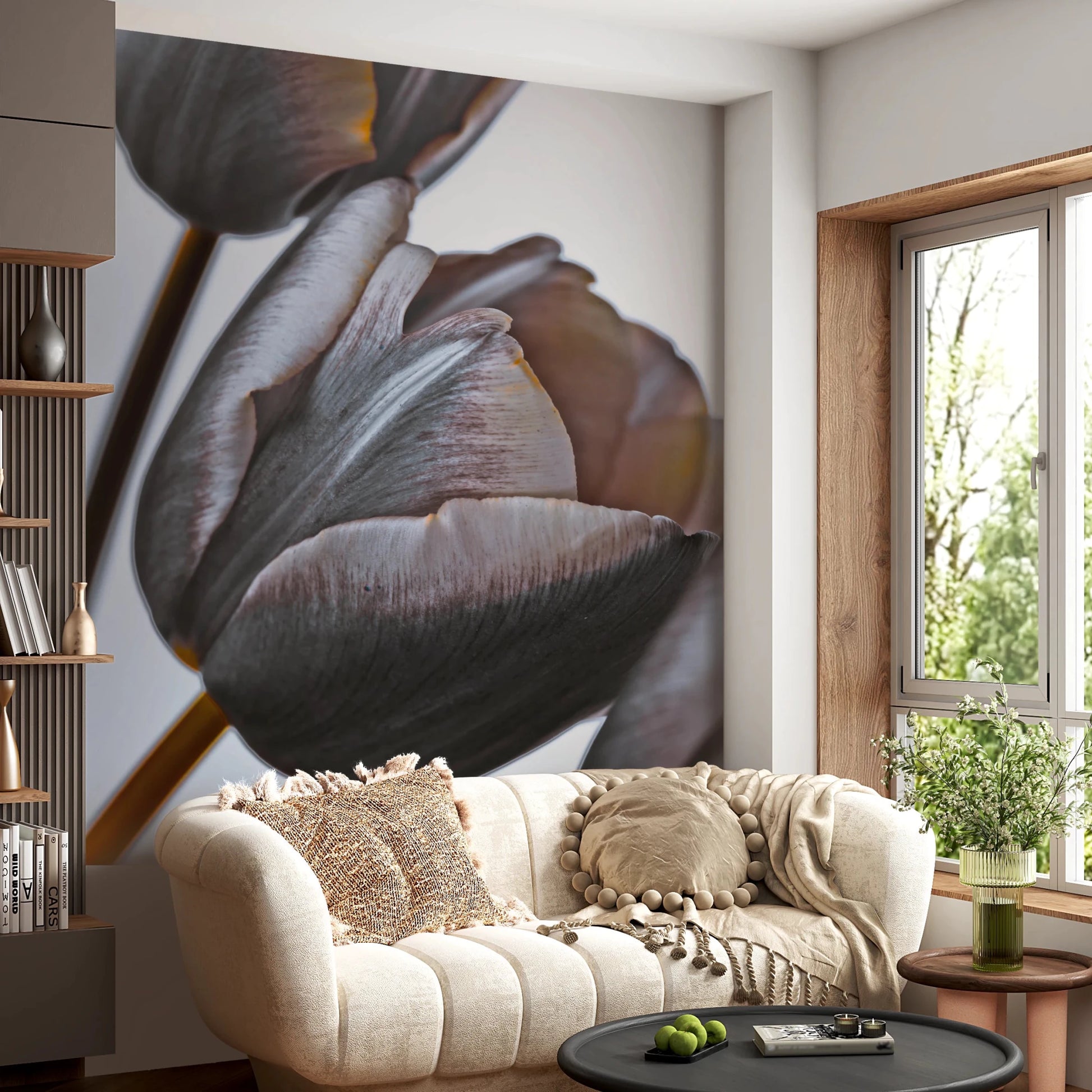 Miracle Tulips wall mural of moody tulip petals behind a cream curved sofa with a pom-pom cushion and knit throw