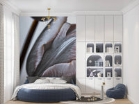 Miracle Tulips wall mural of dusky tulips behind a round navy bed with a brass chandelier in a child's bedroom