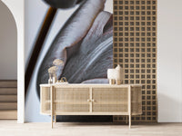 Miracle Tulips wall mural of moody tulip petals behind a cane rattan sideboard with dried flowers in an entryway