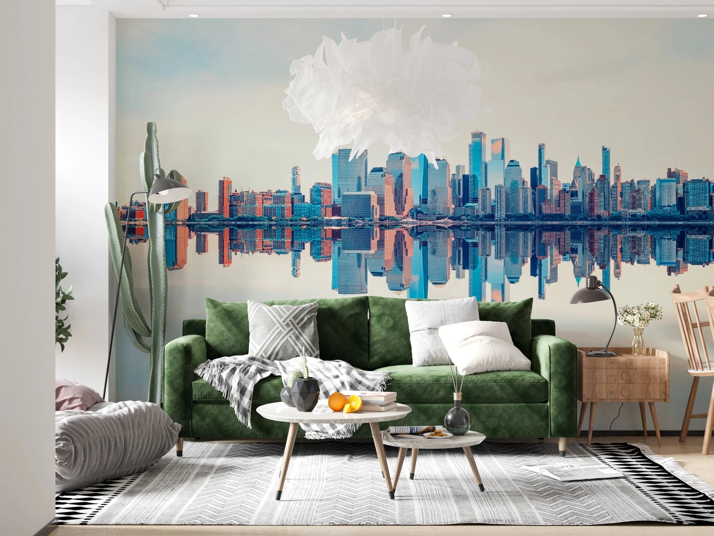 Mirrored Metropolis wallpaper mural of the reflected city skyline behind an emerald green sofa and floor lamp