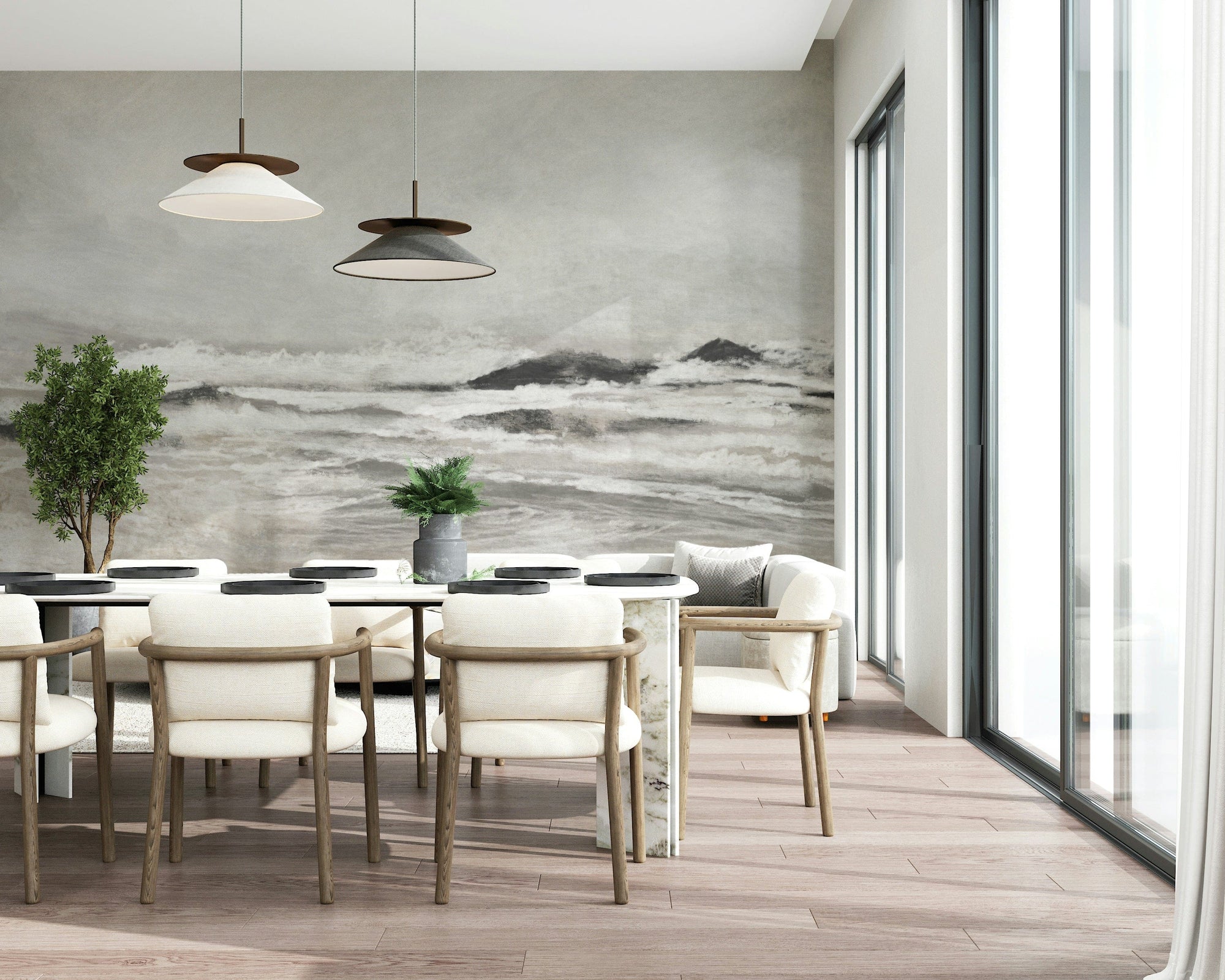 Misty Coast wallpaper mural with grey stormy waves behind a white dining table and cream chairs in a dining room