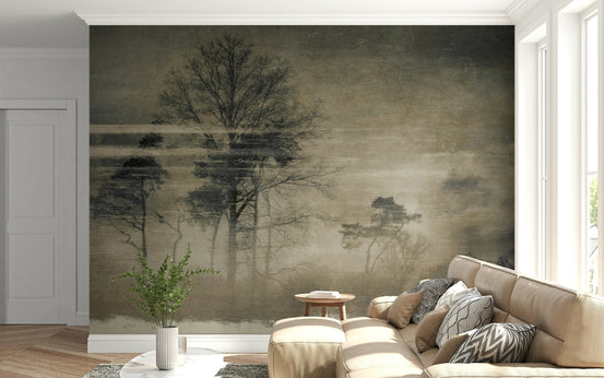 Ethereal Forest wallpaper mural with misty bare trees behind a beige sectional sofa in a bright living room
