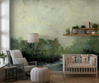 Misty Glen wallpaper mural in a nursery with a white crib, striped rocking chair and leather pouf