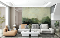 Misty Glen wallpaper mural of an abstract green landscape behind a grey sectional and tan leather chaise