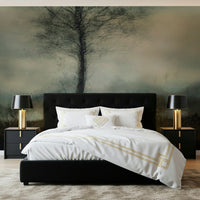 Misty Tree wallpaper mural of a bare tree in fog above a black upholstered bed in a bedroom