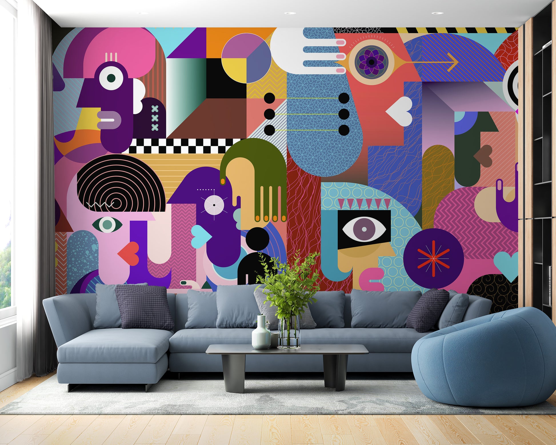 Modern Abstract Faces wallpaper mural of cubist faces and hands behind a blue-grey sectional sofa in a living room
