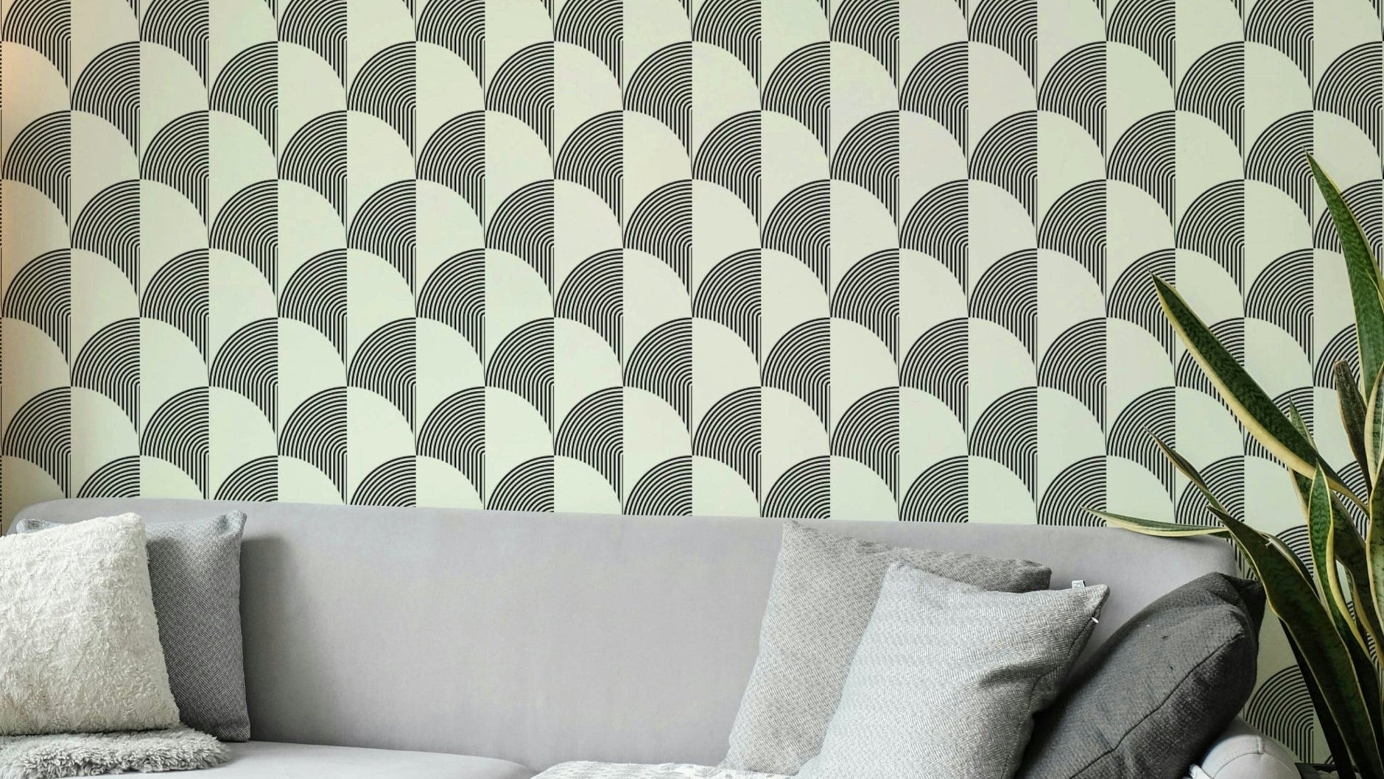 A modern wall mural with a repeating geometric arc pattern.


