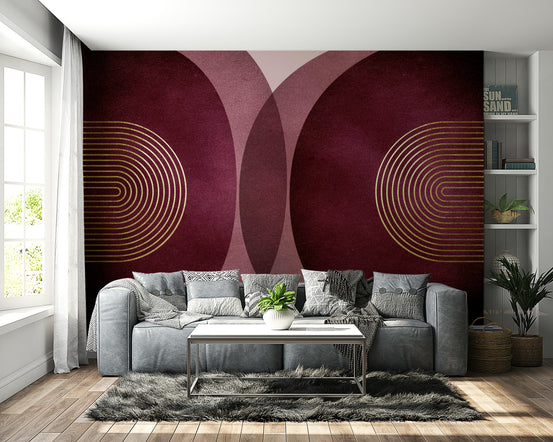 Modern Mid Century Burgundy wallpaper mural with gold arches behind a grey leather sofa and shag rug in a living room