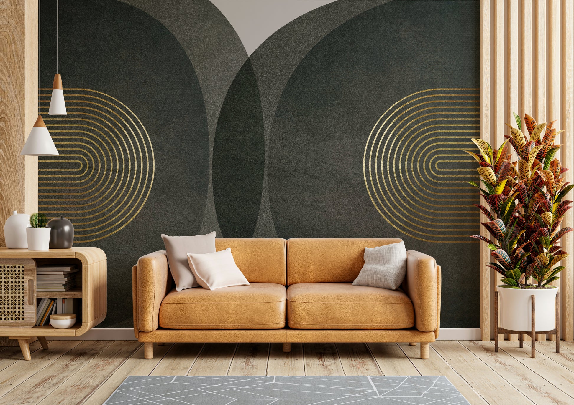 Modern Mid Century Charcoal Gold wallpaper mural with gold arches behind a tan leather sofa and croton plant in a living room