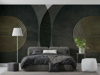 Modern Mid Century Charcoal Gold wallpaper mural with gold arches behind a grey upholstered bed and white floor lamp in a bedroom
